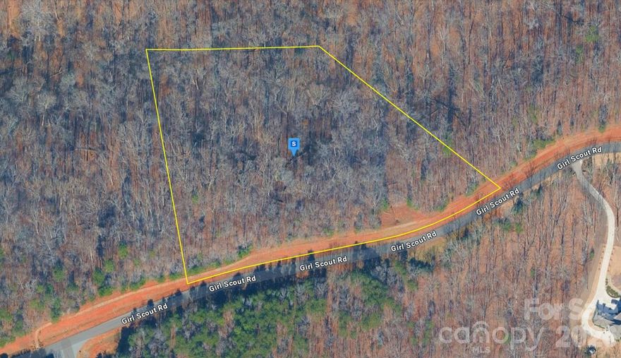 Discover this beautiful 4.83-acre lot in the Charlotte area of Mecklenburg County! Located within an HOA community near Catawba Creek, this property features sloped, wooded terrain that offers privacy, natural scenery, and an ideal setting for a custom-built home. Enjoy access to an incredible waterfront community with resort-style amenities including a waterfront camp area, pool, lake access, walking trails, lodge, tennis courts, and kayak/canoe access. Public water and sewer are available per seller, adding convenience for future development. Experience peaceful surroundings with a scenic natural setting while remaining close to shopping, dining, entertainment, and everything the Charlotte area has to offer. Listing is for land only and comes As Is.
