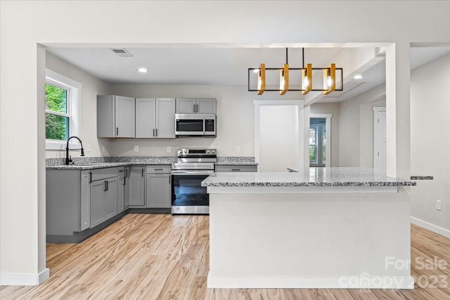 Ask your agent about 100% FINANCING and the new DOWN PAYMENT ASSISTANCE PROGRAMS! There is No Place Like Home! Your STUNNING, fully remodeled home awaits! Located less than 5 mins from Uptown Shelby, this 3 bedroom 2 bathroom home features the perfect floorplan and open living concept. Your spacious living room flows into the gorgeous kitchen which includes granite countertops, a walk-in pantry, a new electric stove, microwave, and a large island accented with a modern black & wood light fixture. Escape to the primary bedroom where your luxurious suite hosts a stunning shower and large walk-in closet. Each oversized bedroom features a modern ceiling fan and generous-sized closets. New, stylish laminate wood floors & tile floors throughout. New electric & plumbing, new LED recessed lighting. Amazingly large yard on a corner lot and closely located to restaurants, trails, & more. This is exactly what you've been waiting for! NO HOA!! Schedule your showing & bring your offers!