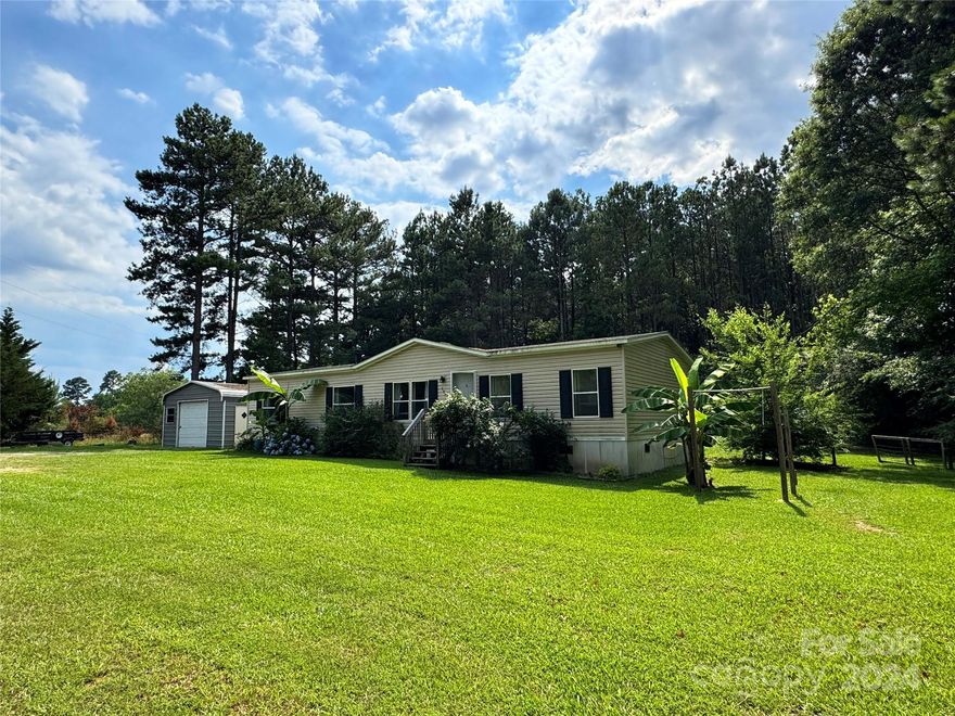 NEW ROOF will completed prior to closing with acceptable offer. 

Escape the hustle and bustle to this charming 3-bedroom, 2-bathroom house nestled on a spacious level lot (just under an acre!) in the Buford school district.    

Step inside to a reasonably open and light-filled space. The large primary bedroom boasts a walk in closet and en suite bathroom with garden tub. Cozy up by the wood-burning fireplace on chilly evenings. Relax and unwind on the back deck, complete with a tin roof for year-round enjoyment, perfect for escaping the summer sun or listening to the pitter-patter of rain.     

Features:

One-car detached garage.
Pull-up bar and monkey bars for convenient outdoor workouts.
Fenced back yard with greenhouse for nurturing your favorite plants.
Fiber internet already installed through Rivernet Connect