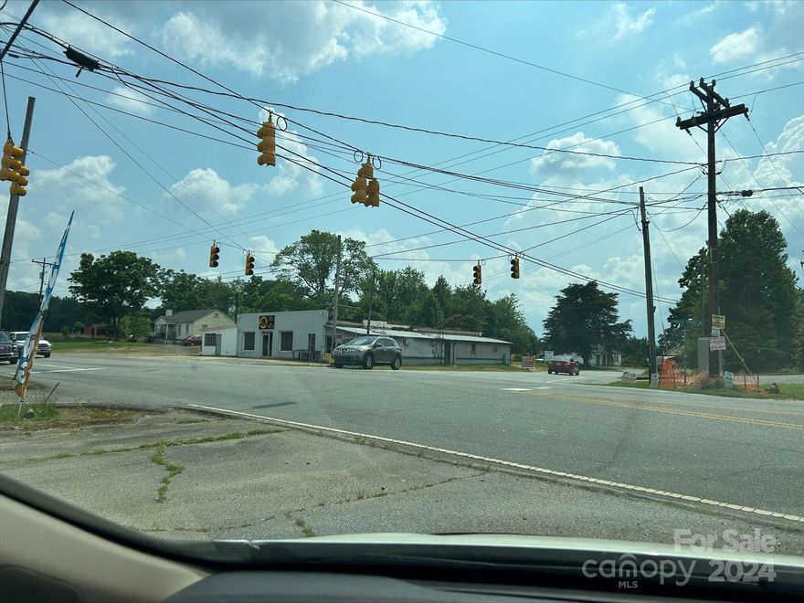 Great corner for future development, while it brings you income in now. builds are rented and home is rented plus billboard is rented. ready for purchase and enjoy the income now and be ready for future corner lot sale! ! !