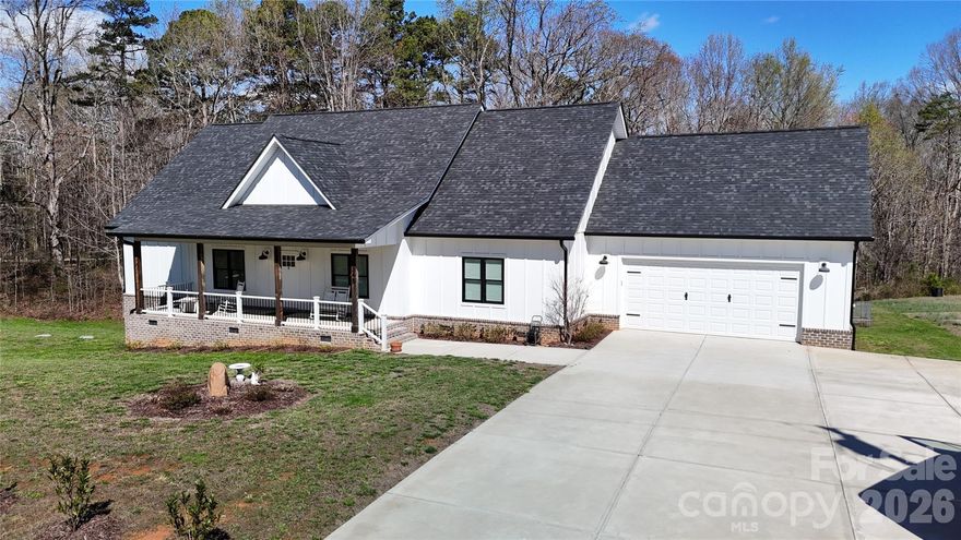 If you’ve been looking for newer construction with room to spread out, this is it. Built in 2021 and sitting on 1.72 acres, this 4 bedroom, 2.5 bathroom home welcomes you with a deep front porch made for rocking chairs and relaxed evenings.  Inside, the layout is both spacious and practical. The kitchen includes pull-out cabinet shelves for easy access and the refrigerator will remain with the home. Just off the garage is a large drop zone area that’s currently a blank slate and ready for you to customize however you’d like. It would a perfect drop zone, work or study area.
The primary suite features a large bathroom with a giant walk-in shower, soaking tub, and double sinks. The primary suite also has a door leading to the deck. One of the secondary bedrooms includes a walk-in closet, and the laundry room is generously sized with a large lockable storage closet.
Additional features include keypad entry at the garage, a 3-stage water filtration system for the well, and a large gun safe that will remain with the home.
Outside, the 1.72 acre property gives you plenty of space to spread out, with blueberry bushes and apple trees already planted. Located in a great school district with North Lincoln Schools.