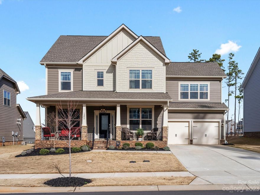 Experience unparalleled luxury in this meticulously crafted 5-bedroom, 4-bathroom residence. The stunning design unfolds throughout, with the main level on-suite. Discover versatility in the oversize bonus room. Step into the outdoor oasis on the custom-covered patio, a perfect retreat for enjoying Carolina summers. Whether you're entertaining or seeking moments of tranquility, this space seamlessly blends the indoors with the beauty of nature. The garage transcends the ordinary, featuring a drop zone. A portion of the garage has been transformed into a room with heating/cooling, offering a flexible space for a home gym or add. living area. Buyers have the option to remove this room. Adding to the allure of this home is the charming southern front porch—a welcoming space to start your day with a cup of coffee. Nestled in the highly sought-after Millbridge, this residence not only provides a dwelling but a lifestyle. Your dream home awaits, promising a life of unparalleled serenity!