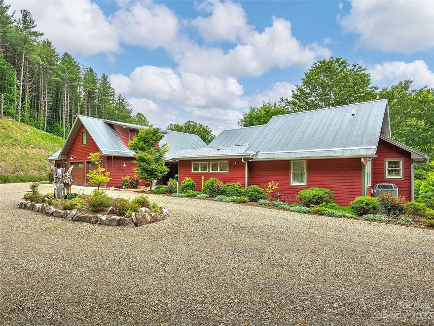 Incredible views make this modern farmhouse and land unique and one of a kind! Nestled in a secluded cove, atop a hill with views of lush fenced pastureland and sunsets. Remodeled extensively in 2017, this home features an open floor plan with stained concrete floors, oversized windows, abundant light, a great room with soaring ceilings, spacious living areas, a primary suite complete with separate walk-in closets and separate bathrooms. An oversized three car garage, a remodeled basement, 4th single garage in basement, fenced-in dog lot, level yard, a pond, several outbuildings, an incredible 3 stall metal barn with water and electricity. So much to see! 2 additional PINS included in the sale. Agent related to seller.