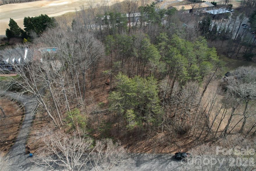 Build your dream home on this beautiful 1.58± acre lot located directly on the 18th fairway of one of the premier country clubs in Western North Carolina. Rock Barn Country Club is one of the top tier country clubs and highly sought after for there phenomenal golf course, spa and other amenities. Enjoy peaceful golf course views, rolling terrain, and the privacy of a spacious homesite within a well-established community.

Public water is available at the road, and a completed soil report provides a strong head start for future construction. Community restrictions and covenants are in place to help protect property values and preserve the quality of the neighborhood. Adding to the long-term appeal, there are future plans within the community for a potential boutique hotel and rooftop restaurant, bringing additional charm, convenience, and lifestyle value to the area.

A rare opportunity to secure a prime golf course homesite with both immediate build potential and exciting future surroundings. Also, just right down the road from Hickory which features great restaurants, shopping, and much more.