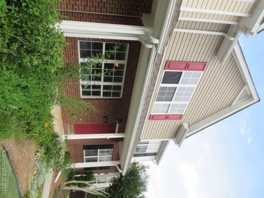 Move-in ready townhome with rocking chair front porch. Open floor plan features new carpet and vinyl flooring throughout. Kitchen with black appliances & center island with granite countertops. Master suite with vaulted ceilings & a deluxe private bath. 2nd master also features a vaulted ceiling, a private bath & walk in closet. Extended patio out back for entertaining.