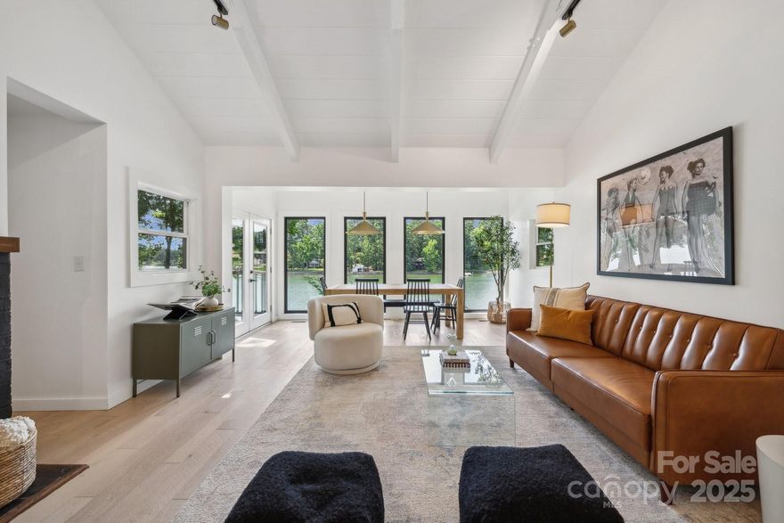 This beautifully renovated waterfront cottage blends timeless charm with modern upgrades, offering a truly rare opportunity of 1.77 acres on sought after Lake Norman. Every detail of the 2024 remodel was thoughtfully chosen, preserving the cozy character of the cottage while elevating it with today’s finishes. Features include stunning wooden vaulted ceilings, open living spaces & a seamless flow to the outdoors. Situated on a private lot along a wide cove, the property includes an additional waterfront parcel, providing endless possibilities. Currently operating as a very successful short-term rental, this property is perfect for both personal enjoyment and income potential.
Spend evenings on the back deck watching the sunset, gather around the firepit, or launch your lake adventures right from your own shoreline. Whether as a primary home, secondary home, investment, or future build site, this one checks every box. So many opportunities!