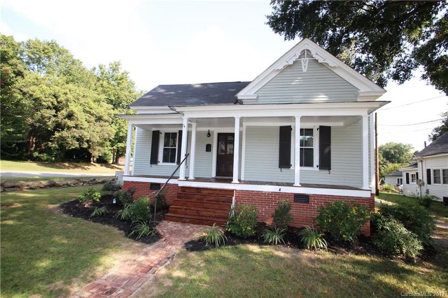 Totally remodeled! So many original moldings & character still exist from when the home was originally built. Which include the original 11 Ft Ceilings & pine floors in all hallways & bedrooms.  The kitchen features all new cabinets, granite counter tops, tile back splash, stainless steel stove & microwave, and a new stainless hood system.  All new interior & exterior paint.  All new vinyl replacement windows, shutters & light fixtures.