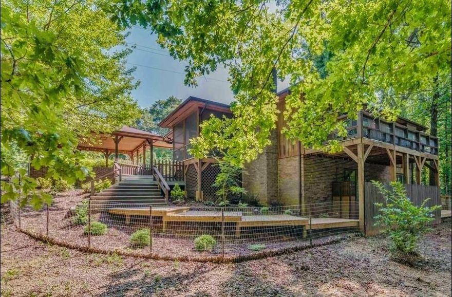 Located on desirable Warrior Dr., this open floor plan, is private and cozy. The tasteful decor and the outdoor spaces add to the ambiance of this well-maintained home. From winter ridge views to summertime treehouse living, this space is a peaceful getaway surrounded by trees. Great screened porch, a covered deck and 2 additional open decks with seating, fenced front & side yards. Look at the stars, relaxing around the outdoor fire pit in the beautifully landscaped backyard. One level living with a separate extra bonus room on the lower level that would make a great office or studio space. 3 large bedrooms include in suite master with walk in shower. 2 car covered attached carport. Updated kitchen, indoor & outdoor lighting (included) and decking. 150SF heated basement is only accessible from the outside. Owner/Seller is also Agent.