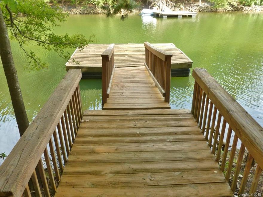 Awesome water view property with private deeded dock. Great views of the lake! Home offers vaulted ceiling in great room, open floor plan, screened porch, 2-car garage. Location, location! Gated waterfront community with club, tennis, golf, marina, walking trails and more!!!