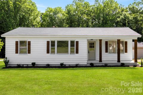 Photo of 301 Gittens Street, Lowell, NC 28098 (MLS # 4381239)