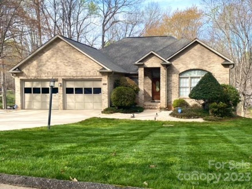 Quality built gorgeous full brick WF home located on quiet road in Denver. Kitchen features granite counters, easy access drawer storage plus upscale stove & venting system. Tile and hardwood floors throughout home. Extensive custom trim including wood ceilings and wall treatments in finished basement. Split bedroom plan with large main level office perfect for work at home situations. Raised hearth wood burning fireplaces in great room and recreation room. Custom patio room with 2nd story deck beyond provides outdoor space for relaxing and entertaining. Treed lot offers serene lake views and privacy. Roof replaced in Nov, 2011 and new water heater in 2023. Home generator system and 2 secured safes convey.