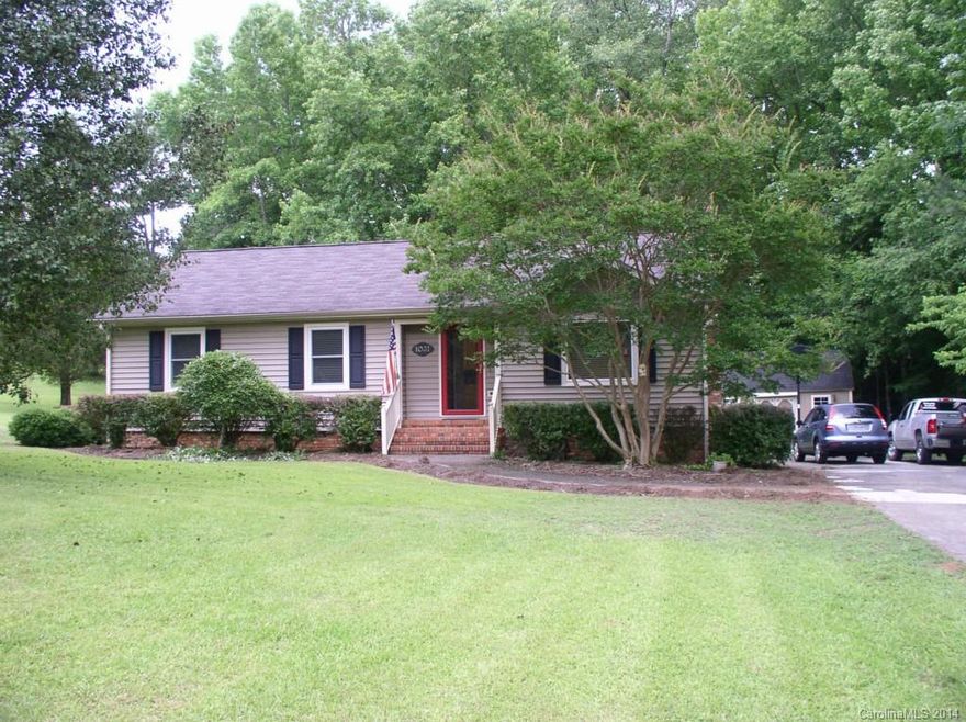 Lovely updated home on 1+ acre. Neutral colors, newer carpet, walnut laminate floors in foyer, living/dining room and kitchen. Baths have ceramic tile and new cabinetry with granite. All new replacement windows with warranty that is transferrable. All window treatments, washer/dryer, and refrigerator remain. Workshop 12x20 is wired for 120-110 and has heat and air conditioning. It has loft and work area. Very private home that is a must see.