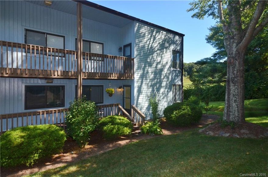 BEST LOCATION!!  This ground level end unit is beautifully appointed & private, offering spectacular mountain & golf course views!  Lge great rm w/a stone fireplace, open dining area, wet bar, all for entertaining family & friends!  Owner waited for this most desirable unit to become available.  Updated HVAC, flooring, carpets & appliances. 2 bdrm/2ba w/master opening to covered porch.  Savor year round views! Walking distance to Waynesville CC or minutes to downtown & shopping. SOLD FURNISHED!