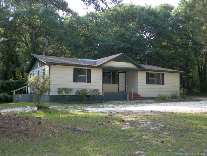 Don't miss this one!  Make this spacious four bedroom, two bath house your home with some update ideas.  Enjoy sitting under your own shade trees or front covered porch.  There is no wasted space in the living area due to the open floor plan of the kitchen/dining and living area.
