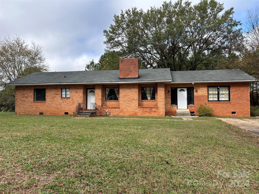 Older home has been painted inside, laminate flooring added. Newer roof. Kitchen & baths need some updating. Has been rented for a number of years. 4th bedroom and additional bath was added with separate septic system. Owner wants to sell "As is condition."