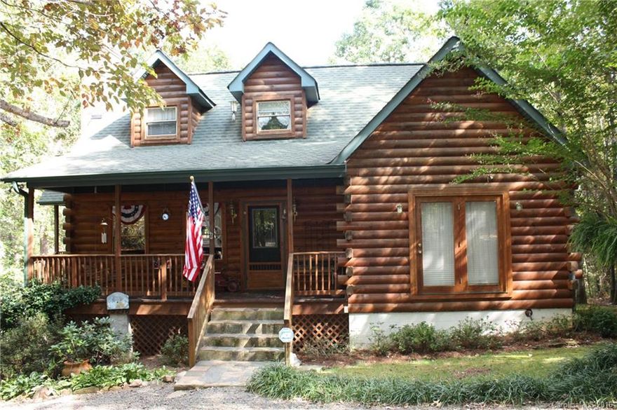 BEAUTIFUL COUNTRY SETTING!! CUSTOM BUILT LOG CABIN HOME ON .92 ACRE LOT. 4BRS. 3.5 BATHS. VERY PRIVATE LOT W/ MATURE TREES. BASEMENT IS PARTIALLY FINISHED HAS BEEN WIRED AND PLUMBED FOR FULL KITCHEN COULD BE 2ND LIVING QUARTERS/ IN-LAW SUITE.  LARGE MASTER SUITE W/ WITH VANITY/DRESSING AREA.  JUST MINS TO I485 AND DOWNTOWN MINT HILL.  2 BRS UP W/ FULL BATH. 1 BR DOWN W/ FINISHED FULL BATH.  LARGE CAR PORT AND OUTSIDE STORAGE BUILDING.  HOME INCLUDES SEPARATE LOT PARCEL#13912927.