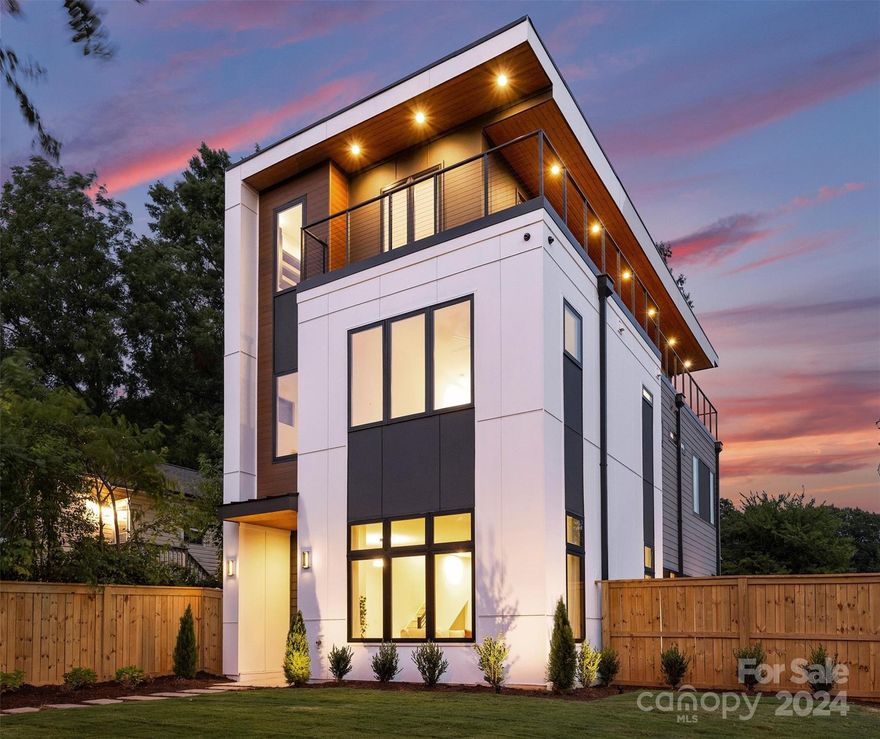 Embrace vibrant Charlotte living in this brand-new 4-bed, 3.5-bath modern gem, ideally located near Uptown, NoDa, and Plaza Midwood. Inside, the sleek open design and high-end finishes shine, with a gourmet kitchen featuring top-of-the-line Cafe Commercial appliances. The living level spacious primary suite offers Uptown views, a luxurious wet room, and a stunning walk-in closet. and 2 additional bedrooms.

The third floor is an entertainer's dream, with a versatile bedroom/office, a flex room with full bar including a beverage fridge, sink, glass washer, ice machine, and a covered walk-out balcony with city vistas. Pre-wired with Cat 6 and equipped with smart switches throughout, the home blends technology with comfort. Integrated speakers in the living room, flex room, and balcony set the perfect ambiance. The detached garage connects to a private patio with a pergola, creating an idyllic outdoor retreat. This is more than a home—it's a lifestyle. Schedule your private tour today!