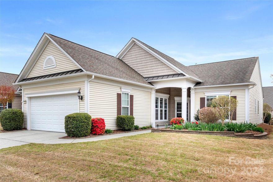 Lovely Surrey Crest home w/ a sunroom + numerous modern finishes! Pre-finished wood flooring flows throughout the home, with LVP in the bedrooms & sunroom! The kitchen boasts stunning quartzite counters, accent tile backsplash, island w/ bar seating, & updated fridge, dishwasher, & microwave. Lots of natural light pours into the open great room, which has gas-log fireplace- great for getting cozy in the winter. The sunroom offers a great spot to drink morning coffee, and the windows have sliding shades to offer more privacy. 2 French doors open to the office/den- great for a home office or hobby room! The primary suite has a tray ceiling, and the en-suite bathroom features a soaking tub, dual sink vanity, and a frosted glass-enclosed shower. The guest bedroom & hallway bathroom are great for your out of town visitors. Out back is the paver patio w/ a paver sitting wall lined by hedge bushes for additional privacy! Come make this home yours & join the active-adult lifestyle in Sun City!