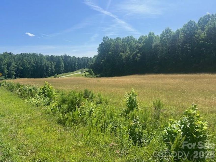 Come See!   **Build your dream home!  Lovely Level Land! ** Prime Location: CORNER Parcel with long ROAD FRONTAGE along Troutman Hill Road,   A Survey shows 6.535 acres. Soil examination letter for Septic available. Currently situated outside city limits. COUNTY TAXES ONLY.  City water/sewer is located on 22nd St (City of Kannapolis for details). This property currently falls under the jurisdiction of the city of Kannapolis Extraterritorial Jurisdiction (ETJ) for planning and zoning purposes. Convenient access to nearby towns including Kannapolis, Landis, and China Grove. Its close proximity to I-85 ensures easy commutes to shopping centers, dining options, and the vibrant Cannon Ballers Stadium in downtown Kannapolis. This is beautiful land!