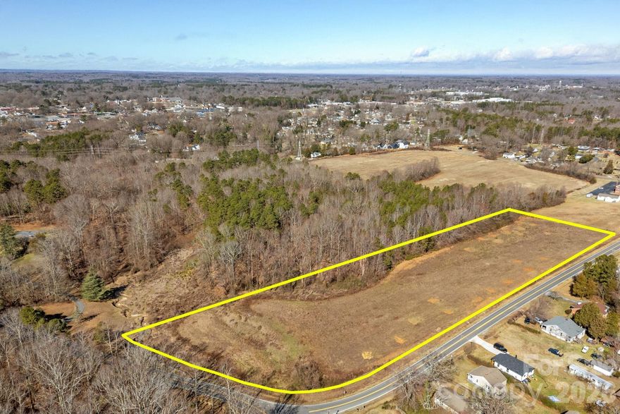 **Build your dream home!  Lovely Level Land! ** Prime Location: CORNER Parcel with long ROAD FRONTAGE along Troutman Hill Road,   A Survey shows 6.535 acres. Soil examination letter for Septic available. Currently situated outside city limits. COUNTY TAXES ONLY.  City water/sewer is located on 22nd St (City of Kannapolis for details). This property falls under the jurisdiction of the city of Kannapolis Extraterritorial Jurisdiction (ETJ) for planning and zoning purposes. Convenient access to nearby towns including Kannapolis, Landis, and China Grove. Its close proximity to I-85 ensures easy commutes to shopping centers, dining options, and the vibrant Cannon Ballers Stadium in downtown Kannapolis. This is beautiful land!