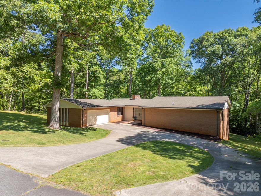 Tucked away on 1.19 private acres in a quiet cul-de-sac, this spacious brick home offers the perfect blend of comfort, character, and convenience. Located just minutes from downtown Forest City, you will enjoy easy access to local pubs, restaurants, shopping, and community events while still coming home to a peaceful, wooded setting. Inside, the main level features a large kitchen with a dining area, a formal dining room, and an inviting great room centered around a cozy wood-burning fireplace. The primary suite offers a walk-in closet and private bath, while on the main level, you will find two additional bedrooms and a full bathroom, providing comfortable space for family and guests. The lower-level apartment area creates endless possibilities for multi-generational living, guest accommodations, or entertaining. This versatile space includes a bedroom, bathroom, a den with a wood-burning fireplace, a billiard/entertainment room, and a dedicated storage area, offering ample space for hobbies, seasonal items, or extra organization. Outdoor living is just as impressive with a huge 672-square-foot deck overlooking the beautiful natural surroundings—perfect for relaxing, grilling, or hosting friends and family. A garage provides additional storage and convenience. With easy access to Charlotte, Spartanburg, and Asheville, commuting and weekend getaways are a breeze. This property delivers small-town charm with big-city accessibility—don’t miss your opportunity to make it yours!