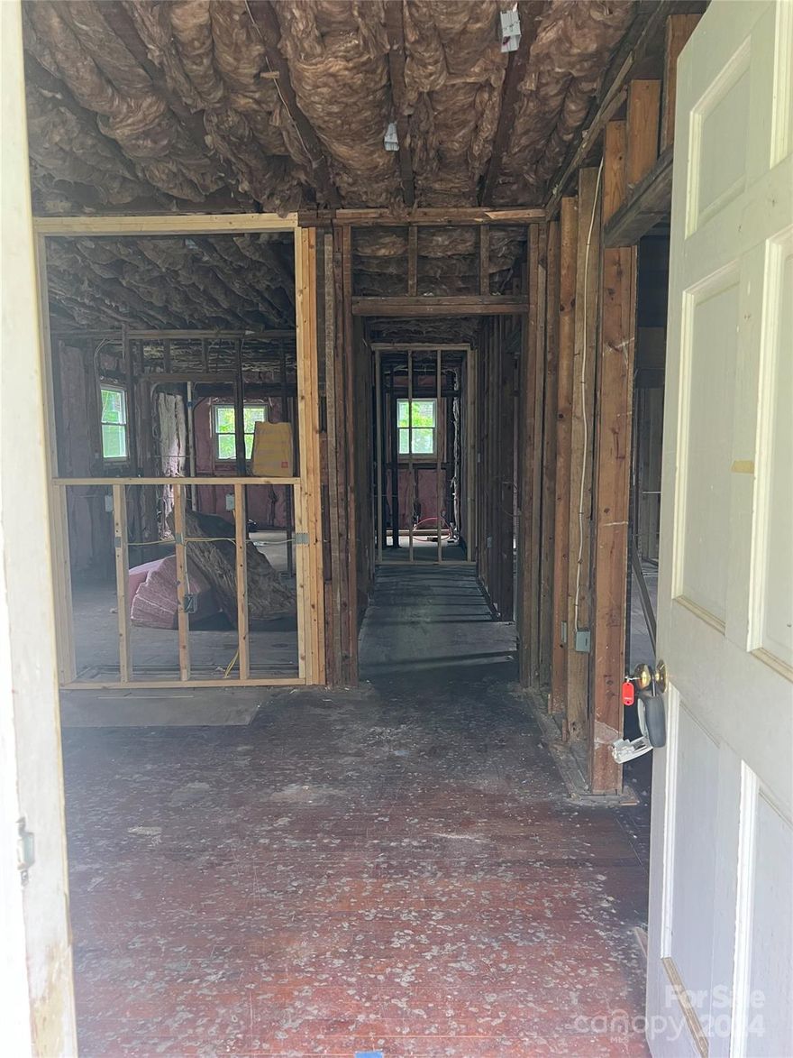 This partially renovated property is a perfect opportunity for savvy investors looking for a quick project to finish or for a fix-and-flip investor or a buyer looking to add value through finishing the renovation. Originally a charming 2-bedroom, 1-full bathroom home, this house has been expanded and reimagined into a spacious 3-bedroom, 2-full bathroom residence. Key updates include rough electric & plumbing already completed, saving you time & effort. It has all new windows, new vinyl siding, new roof, new framing & insulation. Part of the wraparound porch has been enclosed, increasing the living space from 1,179 sq. ft. to 1,297 sq. ft. Most of the heavy lifting has been done, allowing you to focus on finishing touches to significantly increase the property’s value. Situated on a Cul de Sac, in a desirable neighborhood, close to schools, shopping, &dining. Don't miss out on this rare opportunity to customize & complete a flip project with substantial improvements already made!