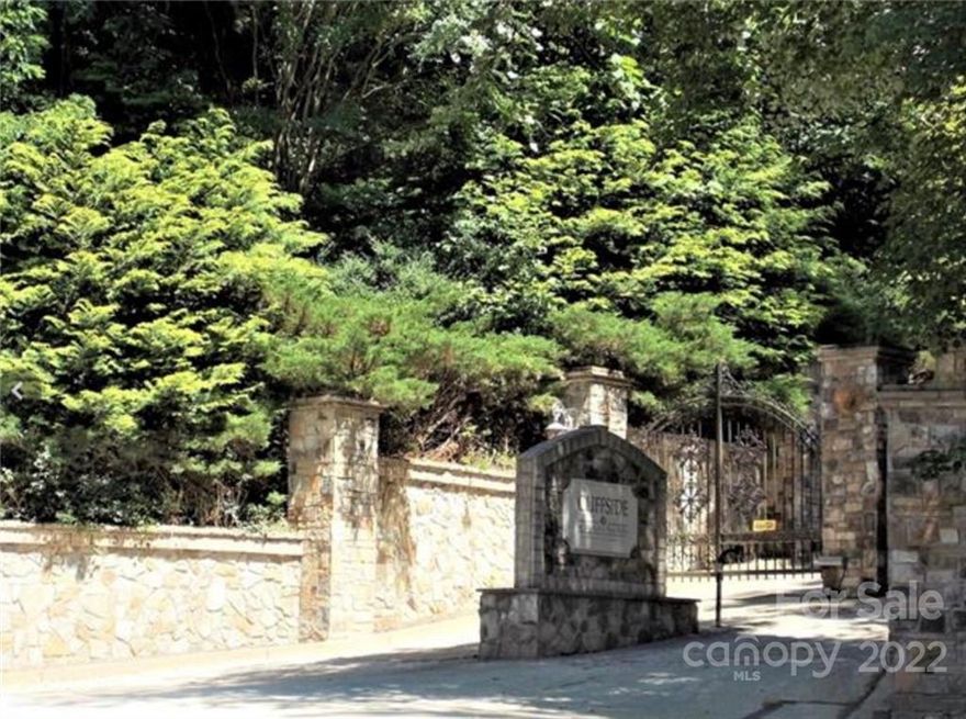 AMAZING VIEWS of Hickory Nut Falls.
Owner will consider financing.
Gated development adjacent to historic Chimney Rock. Approx 1 mile from downtown Chimney Rock and the entrance to Chimney Rock State Park. Listen to the river from this amazing lot, a small bit of tree trimming will provide an amazing view of the surrounding escarpment and an unencumbered view of Hickory Nut Falls, the 404 foot waterfall, second highest of its kind east of the Mississippi River. 
Large granite boulders provide remarkable character and unique possibilities. Base for driveway into property is existing, but needs refreshing.
Property is in very close proximity to Lake Lure, just minutes away. Public water and sewer are available, all utilities are underground. Small annual HOA fee of approx. $700.00. CCRs are attached. Construction review required with 1800sf HLA minimum.