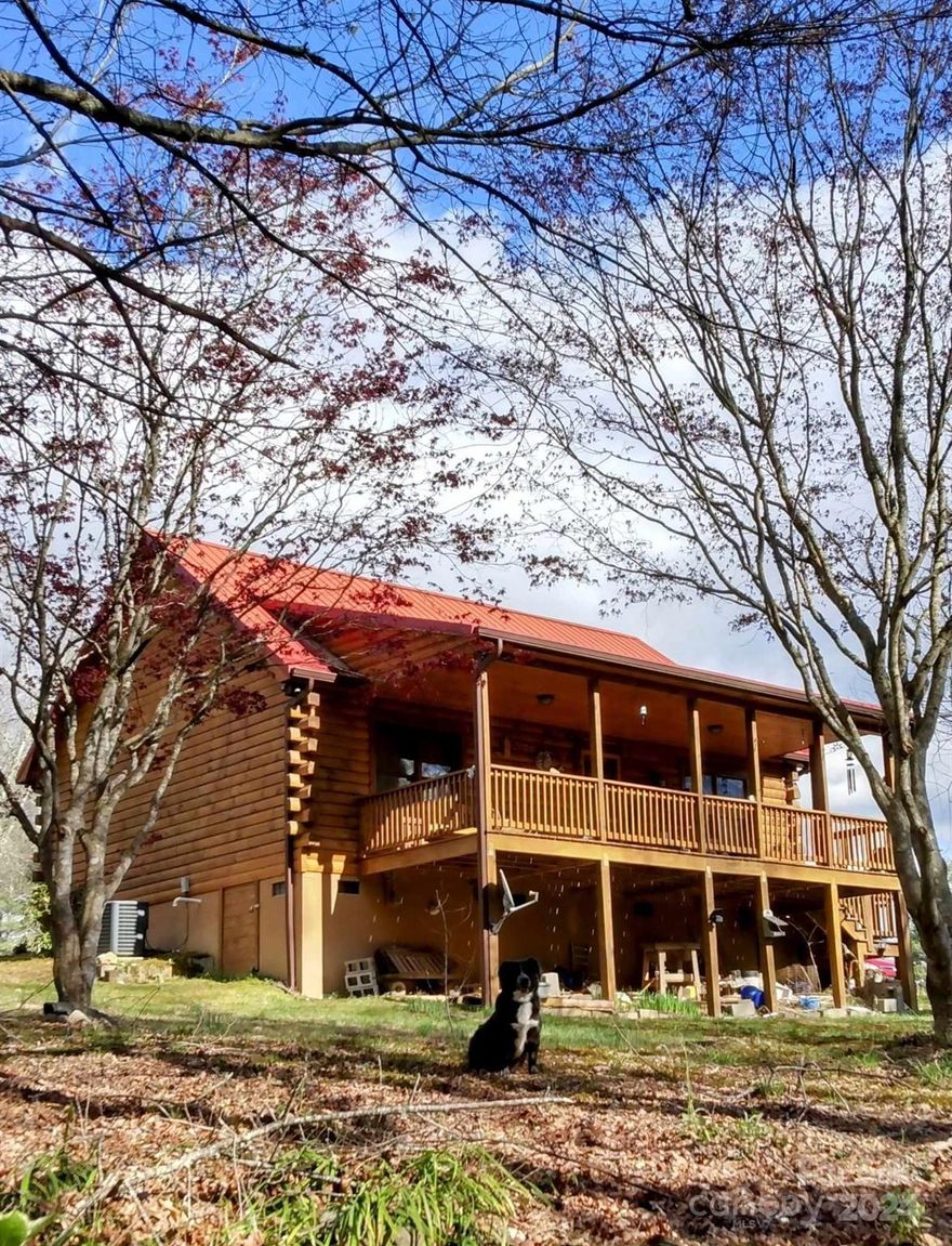 This charming cabin is situated on .69-acres, features hardwood floors, an open concept floor plan, spacious kitchen, 2 large bedrooms, a bathroom that features a stackable washer and dryer for convenience, a living space that extends seamlessly to a covered spacious porch and side deck. A Fabral metal roof adds durability to the structure. The property has a spring fed creek, and is adorned with an array of breathtaking foliage– a flower lover's dream. The outdoor enthusiasts, this cabin is a gateway to adventure. Plenty of trails for bike riding, access to a stocked trout pond, perfect for a relaxing day of fishing. The property sits just below Linn Cove Viaduct, Grandfather Mountain which offers hiking and exploration, Wilson's Creek and Linville Gorge for hiking, swimming, and fishing. 14 miles to Blowing Rock where there's plenty of boutique shops and art galleries, and Banner Elk provides a winter wonderland for ski enthusiasts with proximity to Sugar Mountain Ski Resort.