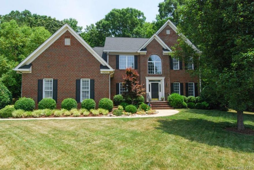 Custom features in full brick home with wood lot and 3 car garage.  Enjoy the architectural features added by this seller including custom bookshelves, kitchen island, butler's cabinet, wood deck with built in flower boxes and special outdoor living space with swings and fire pit. All bathrooms are fabulous. Kitchen updated and stylish. Clean, neutral and move in ready.  Community has pool, and club house. NEW AC, Water heater and ROOF. Built in workbench and shelving in the garage. Immaculate.