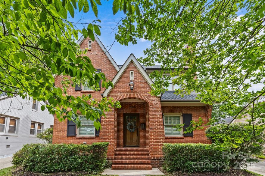 Charming updated brick cottage in the heart of Dilworth! Situated in a highly sought-after location, this 4BR/3BA home offers 2,639 sq/ft of beautifully updated living space just around the corner from East Boulevard’s shops, dining, and neighborhood parks. The main level boasts a functional open floor plan with hardwood floors, crown molding, and plantation shutters. The light-filled formal living room features built-ins and a gas-log fireplace with marble surround. The dining area features a coffered ceiling and flows into the Chef’s kitchen with white custom cabinetry, granite counters, stainless appliances, subway tile backsplash, and a center island. A cozy den offers great casual living space! Flexible bedroom/office, full bath, and mudroom complete the main floor. Upstairs, the spacious primary suite includes a custom walk-in closet and spa-like bath with dual vanities, clawfoot tub, and frameless glass shower. Also upstairs find 2 additional bedrooms, a shared bath with dual marble vanity, and a “hidden” laundry room. Enjoy year-round entertaining on the incredible screened porch with custom bar, plus a fenced backyard, gated driveway, and detached garage with storage room!  Recent updates to the HVAC systems plus new water heater. Completely move-in ready and a wonderful opportunity to live in one of Charlotte’s most desirable neighborhoods!