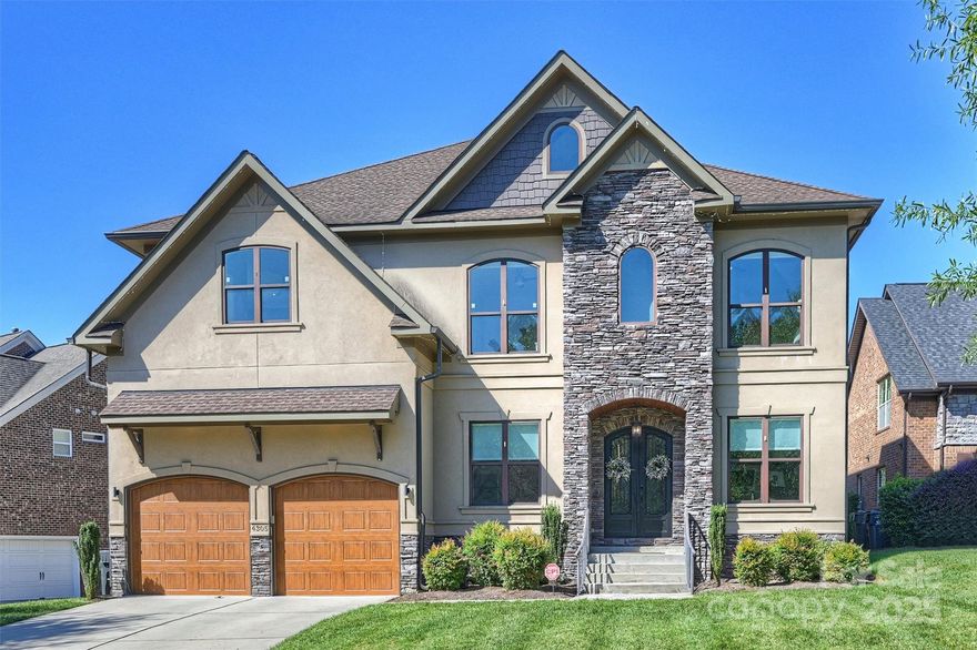 Stunning Luxury Home in Sought-After Sheffingdell. Welcome to 4305 Jasmin May Dr, an exquisite 5-bedroom, 4.5-bath residence nestled in the heart of South Charlotte’s desirable Sheffingdell community. This custom-designed home blends elegance with functionality, offering exceptional spaces for both everyday living and entertaining.

Step inside to find a light-filled floor plan enhanced by hardwood floors, modern lighting, and thoughtful architectural details throughout. The formal dining room sets the stage for gatherings, while the great room with coffered ceilings and built-ins provides a warm and inviting atmosphere. A gourmet kitchen serves as the centerpiece of the home, featuring a gas range, oversized island, walk-in pantry, and a convenient wet bar area.

A main-level bedroom with en-suite bath and private deck offers comfort and flexibility for guests or multi-generational living. Upstairs, you’ll find oversized guest suites each with private en-suite baths, a large laundry room with built-in cabinetry and sink, and a spacious bed/bonus room perfect for recreation or media.

The primary suite is a true retreat, showcasing a spa-like en-suite with a walk-in shower, standalone soaking tub, dual vanities, and stunning walk-in closets. A private office or nursery is thoughtfully connected to the suite for added versatility.

Enjoy the outdoors year-round on the covered patio complete with a gas fireplace, built-in grill, and sink, overlooking the fenced backyard—ideal for entertaining or relaxing in style.

With its luxury finishes, ample storage, and premier location close to top schools, shopping, and dining, this Sheffingdell gem is truly move-in ready.