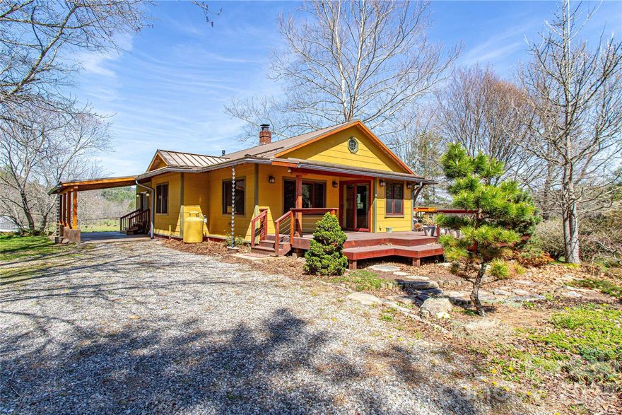 Experience the perfect harmony of mid-century charm and Zen-inspired luxury on this 1.88-acre Leicester estate. This masterfully updated farmhouse exudes warmth, showcasing original 1940s unpainted wood trim, hardwoods, and a custom kitchen with reclaimed cabinetry, concrete counters, and a unique bowling alley wood island. The spacious layout includes a 23’ living room with a gas fireplace.

Storage is unparalleled, featuring a large walk-up attic and a walk-out basement with a workshop and finished bonus room. The property’s crown jewel is the stunning guest cottage - a light-filled sanctuary featuring reclaimed barnwood floors and Shoji pocket doors that lead to a serene Japanese-style bath, complete with an indoor hot tub and garden-view shower. This easily provides the opportunity for rental income or a special space for family and friends.

Outdoor living is exceptional, with multiple expansive decks and a tranquil screened porch perfect for taking in the mountain views. Immerse yourself in the idyllic setting of professional Japanese gardens, featuring a majestic 20-year-old Ginkgo tree and five cherry trees. With a commercial-grade metal roof and a newer 4-bedroom septic, this HOA-free sanctuary offers the total package just 25 minutes from Downtown Asheville. Be ready to fall in LOVE.