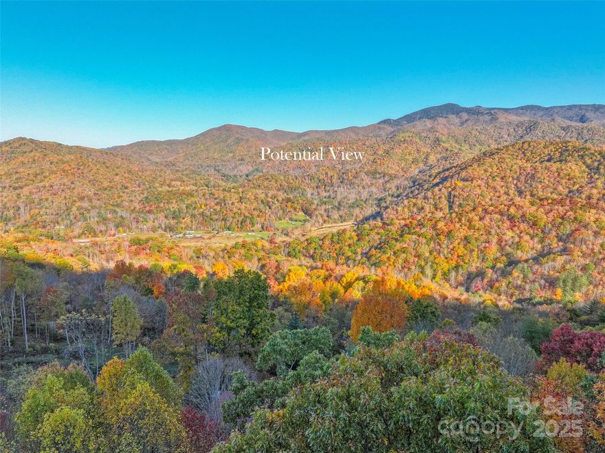 Build your dream mountain home on this beautiful 2.5 acres with a million-dollar view of the Black Mountains in a quiet, peaceful subdivision with a few restrictions.  12 minutes from downtown Burnsville and 50 minutes to downtown Asheville.  The property is wooded, with a lovely knoll in the center where you can build.  3300' approximate elevation offers great views and cool breezes.  No damage from Helene.  The gravel road is well maintained, $500 a year annual dues.

See documents and photos for approximate lot dimensions.

Virtual home layouts on the lot.
https://youtu.be/SigY1Ovm8zw