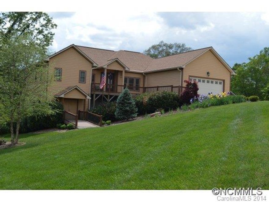 Steal this Deal - Luxurious custom home boasts all the extras... sophisticated living areas upgraded surfaces - accommodating baths and kitchen - Granite tops, tile shower, whirlpool, Anderson windows, 10 foot ceilings, majestic VIEWS, low maintenance exterior, All one level living,  huge dry lower level for work shop or expanded living.. garage on main.. fenced yard.. Priced $200,000+ under cost... sellers relocated to be w/ grandchildren