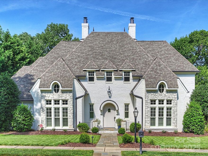 This elegant SouthPark home features a bright, open floor plan with high-end finishes. The family room, with a fireplace and built-ins, connects to the chef’s kitchen, which includes dual Thermador ovens, a gas range, large island, butler’s pantry with beverage cooler, and walk-in pantry. Adjacent are the laundry room and a dedicated office. The front study and dining room have cathedral ceilings. The main level primary suite offers a spa-like bathroom and large his-and/her closets with Closet by Design. Upstairs are three en-suite bedrooms with custom closets, a playroom, and exercise room. The massive bonus room with a wet bar is perfect for entertaining. Outdoors, a covered porch overlooks a lush backyard with built-in grill and fire pit. The three-car garage provides ample storage. Recent updates include two new HVAC systems (2025) and new carpet (2024). Located in the heart of SouthPark, this home blends luxury and convenience.