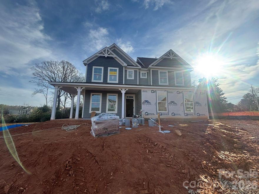 This 3-story Davidson plan has 6 bedrooms, 4.5 baths, a sunroom, 3-car garage, and more than 3,500 square feet of living space. The main floor includes a guest bedroom & full bath, a dining room with tray ceiling, an office with faux coffered ceiling, and a family room with a gas fireplace and shiplap feature wall. The designer kitchen has a farmhouse sink, white cabinets with a contrasting island, quartz counters, tile backsplash, a stainless range hood, and stainless appliances, including a gas cooktop. The second floor includes a loft, the primary suite with a luxury bath, and three secondary bedrooms. Two of the bedrooms are connected by a Jack-n-Jill bath. The third floor has a spacious bedroom with a full bath. The beautiful sunroom walks out to a paver patio with firepit and seating wall. Other wonderful extras are Craftsman-style wood trim, a drop zone in the mud room, and quartz counters in all baths. Neighborhood amenities include a pool, dog park, clubhouse & fitness center. Visit today!