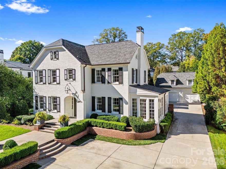 LUXURY LIVING IN MYERS PARK! This spectacular residence, extensively renovated by Gerrard Builders in collaboration with Carolina Design Associates, exudes timeless elegance and sophisticated design. Filled with natural light, the home showcases high ceilings, expansive open spaces, and a highly desirable floor plan designed for effortless entertaining and comfortable everyday living. Exceptional craftsmanship and high-end finishes are featured throughout. The show-stopping chef’s kitchen opens seamlessly to a fireside family room and sunny breakfast area, creating the true heart of the home. Generous living and dining spaces provide ideal settings for gatherings both large and intimate. The spacious primary suite serves as a private retreat, complete with a beautifully appointed bathroom with balcony and walk-in closets with custom built-ins. The main house offers five bedrooms and five full bathrooms, along with an additional versatile bonus/bedroom and sunroom to suit a variety of needs. Above the detached garage, an additional bonus room with a full bath provides flexible space for guests, a private office, or studio. Outdoor living is equally impressive. A covered porch overlooks the private, fenced backyard featuring a play area perfect for relaxing or entertaining year-round. Quaint side patio ideal for grilling and dining outside. Convenient to shops and restaurants in Myers Park, Dilworth and easy commute to Uptown!