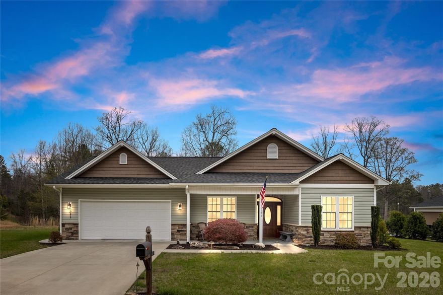 There’s a difference between a home that simply checks the boxes… and one that feels right the moment you arrive.

Nestled on a beautifully positioned .35-acre lot, this thoughtfully designed 3-bedroom, 2.5-bath home offers the best of both worlds—peaceful, rural surroundings with the convenience of city water and sewer. Tucked away just outside the hustle, yet only minutes from everything you need, this is where comfort meets connection.

From the moment you step onto the inviting front porch and through the striking entry, you’re welcomed by a sense of warmth and flow that carries throughout the home. Inside, rich wood flooring spans the main living areas, creating a clean, elevated look, while plush carpeting in the bedrooms adds comfort where it matters most.

At the heart of the home, the living space is anchored by a gas log fireplace, offering a cozy focal point perfect for quiet evenings or gathering with friends and family. Natural light pours in, enhancing the open feel and effortless livability of the layout.

Step outside and you’ll find one of this home’s true highlights—a screened-in porch that invites you to slow down, unwind, and take in the peaceful surroundings. Whether it’s morning coffee or evening conversations, this space extends your living experience beyond the walls.

The spacious two-car garage provides ample room for vehicles, storage, or hobbies, while the lot itself offers just the right balance of openness and privacy.
for adde peace of minded this house comes with a one year Home warranty