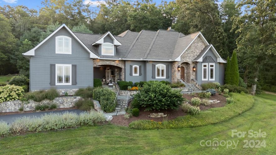 Luxury retreat with stunning year-round views in the gated community of Mill Ridge. On a meticulously landscaped corner lot, on approx 2.76 acres, you can entertain or relax with superb indoor/outdoor living. Impeccable craftsmanship throughout this 4 bed 3.5 bath home with hardwood floors, built-ins, tongue/groove millwork, and stonework. Gourmet eat-in kitchen with Thermador oven, & microwave warming drawer in-the-wall. Huge Master Suite with fireplace on the main level boasts custom Jacuzzi and Steam Shower with digital control, & walk-in closet. Formal dining room, multiple bonus rooms include game room, home theater, formal dining. Two double garages. Furniture negotiable. This is a must-see gem!