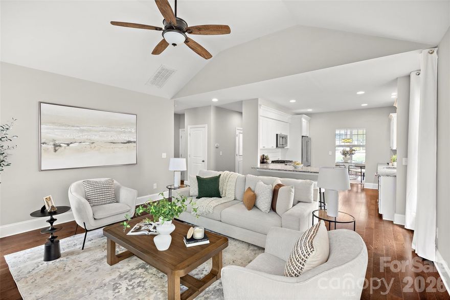 Built in 2016 and located in desirable Bishops Ridge, this beautifully maintained home offers the appeal of newer construction paired with warm finishes, thoughtful upgrades, and an ideal South Charlotte location. Rich hardwood floors throughout the main living areas welcome you inside, where an open-concept layout, vaulted great room, and designer kitchen create a bright, inviting atmosphere designed for both everyday living and easy entertaining.

The kitchen serves as the heart of the home, featuring white shaker-style cabinetry, granite countertops, stainless steel appliances, subway tile backsplash, a center island with seating, and an easy connection to both the dining area and great room beyond. Upgraded molding, trim details, and custom paint selections add character and polish throughout, while brand new carpet in the main-level primary suite and upper level provides a fresh finishing touch.

A highly desirable main-level owner’s suite offers comfort and convenience, complete with a spacious en suite bath featuring an oversized glass-enclosed shower, generous vanity space, and a large walk-in closet. Upstairs, a spacious loft provides flexible living space ideal for a media area, playroom, office, or second den. The upper level also features a second oversized owner’s suite with private en suite bath, along with two additional bedrooms and a hall bath, creating a versatile layout well-suited for guests, multigenerational living, or households needing room to spread out.

The outdoor living is equally inviting. Just off the main living area, a large rear deck provides the perfect place to relax, entertain, or enjoy peaceful views of the natural wooded backdrop beyond. The rear yard has been thoughtfully leveled and includes a fenced play area, offering a more usable and enjoyable outdoor space while still feeling private and serene.

Bishops Ridge residents enjoy HOA amenities that include a pool, tennis courts, clubhouse, and water, adding both convenience and lifestyle appeal. Set in a wonderful South Charlotte location with easy access to a wide variety of shopping, dining, and everyday conveniences, this home offers the space, style, and setting today’s buyers are looking for.

This home offers the rare combination of newer construction, flexible living, beautiful finishes, and a peaceful outdoor setting in one of South Charlotte’s most convenient location!
