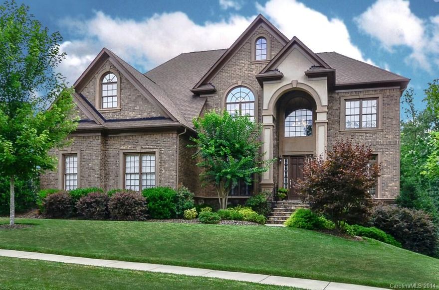 Beautiful 2-Sty Bsmt home in the exclusive Enclave section. Amazing KT w/exotic granite, huge island, 5-b gas range, ss appls - open to 2-Sty GR w/gas FP & built-in's. Guest BR on main level. Huge Master Ste w/adjoining flex space + 3 add'l BR's on 2nd flr. Basement is plumbed for a Wet Bar and offers a Playroom, Rec Rm, full Bath. Add'l space can be finished for a BR, etc. Large deck with brick paver patio below w/fire pit - fenced bkyd. Plantation shutters * tinted windows * closet organizers.