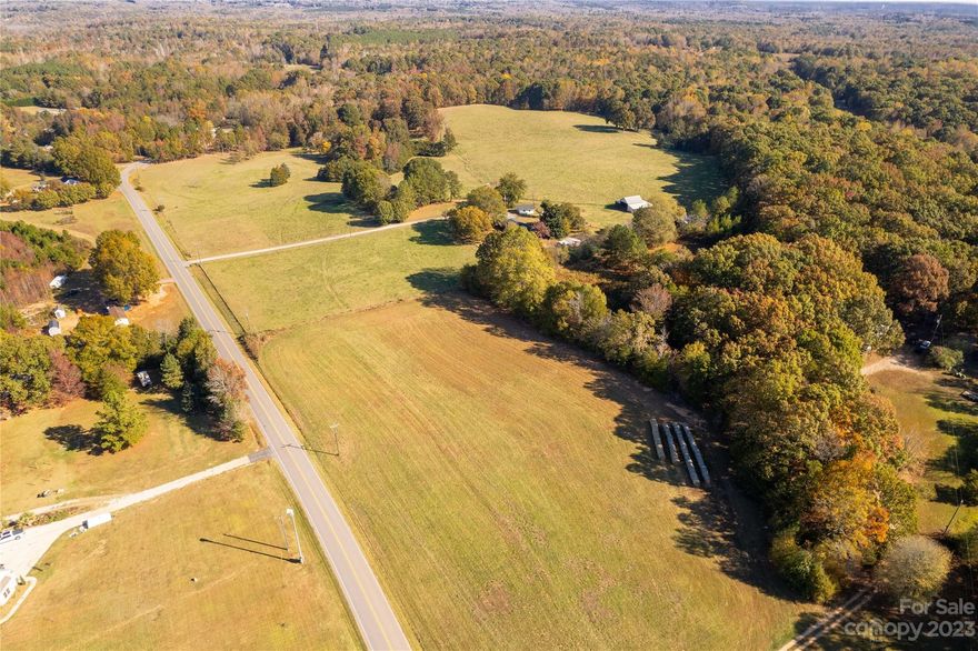 A dream opportunity with this gorgeous private estate where there's sprawling prime farmland, fenced pastures and unlimited possibilities to enjoy nature in its full glory!   Bundled into this custom estate are two brick ranch homes surrounded by 40 acres including a stream/creek flowing through the property and numerous barns and outbuildings for all your storage and farm needs.  Explore the options of a rental, guest home or even multigenerational living with the secondary residence.  2344 Wood Road has 1657 sq ft with three bedrooms and two baths, attached 2-car carport and a detached 2-car garage.  2368 Wood Road provides 1889 sq ft of living space with three bedroom and two baths.  In addition, it has an attached 2-car garage, sunroom, and a spacious rear porch perfect for enjoying the peaceful countryside evenings.  Come plant your roots here and see the adventures grow!  This property is also listed as Multi-Unit, MLS # 4097109.