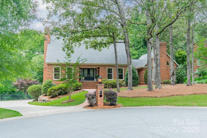 Charming all-brick house nestled on cozy cul-de-sac, this home has it all! Great Arboretum/south Charlotte location + this lot opens to Hembstead walking trail (which leads to amenity center)! Wide & welcoming Foyer opens to large Office (complete w/French door & built-in shelving) on the R and a gorgeous volume-ceiling Great Rm on the L. Gleaming HW floors have just been re-finished for you new homeowners! Step into the GR & note the fireplace as well as the awesome views both front & back! Dining Rm hosts a wall of windows to entice you into the lush backyard space complete w/fire pit area. Kitchen has granite counters, under-cabinet lighting & huge window into the wide covered deck where you will love to relax & entertain! Primary BR on main w/second fp & volume ceilings also has access to deck! Upstairs you'll find 2BR's, a flex space used as Guest Room + loft for reading/study/play space/whatever! Lower level more fun flex spaces, full Bath, + sliding door to paver patio. MUST SEE