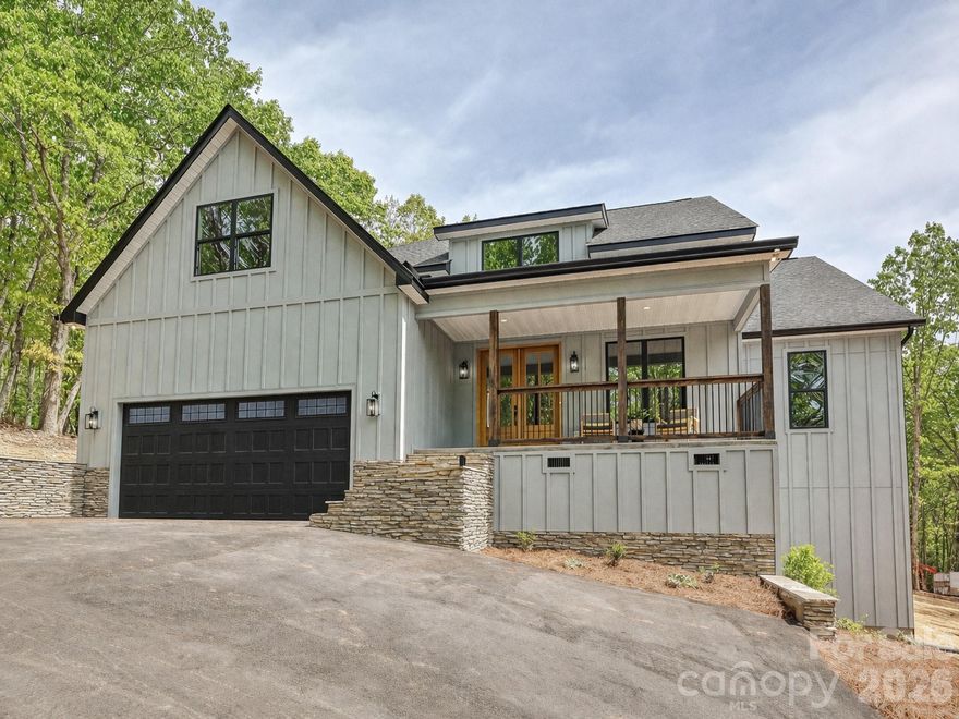 A truly rare offering in York County, this property delivers an exceptional mountain-retreat setting while backing to the protected landscape of Nanny’s Mountain Historical Park. From your backyard, enjoy ~ 2 miles of scenic trails leading to a scenic overlook with sweeping views of Lake Wylie, Kings Mountain, and even the Charlotte skyline on a clear day.

Inside, the thoughtfully designed open floor plan sets this home apart. The dining area features dramatic arched ceilings, while the living room showcases upgraded trim work and custom details that add warmth and character throughout.

The chef’s kitchen is a true centerpiece, anchored by a massive quartz island, timeless marble-inspired subway tile backsplash, a custom range hood, coffered-like ceiling accents, and abundant cabinetry. The spacious walk-in pantry offers incredible storage and the potential for the scullery of your dreams.

The primary suite feels like a private retreat with a spa-like shower and generous space to unwind. A versatile bonus room provides flexibility for a home office, playroom, or additional lounge area.

Thoughtfully constructed with quality craftsmanship, the home includes spray foam insulation for superior energy efficiency, comfort, and long-term performance.

Located within the highly anticipated Clover School District, with brand-new schools scheduled for completion in time for the August 2026 school year. This home also offers easy access to Lake Wylie, the charming shops and dining of historic downtown York & Clover, and is just over 30 minutes to Uptown Charlotte—giving you the perfect balance of peaceful living with convenient access to everything the region has to offer.

A truly unique home for this area, combining elevated views, and custom design! NO HOA!