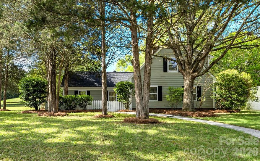 Welcome to this charming 3-bedroom, 2-bath home in the highly desirable Candlewyck community in south Charlotte. Situated on an almost half-acre corner lot, this property offers room to spread out with mature trees, established landscaping, and open green space that provide both privacy and flexibility for outdoor living. Backing to a peaceful, tree-lined nature trail, the home offers a rare combination of usable outdoor space. Inside, the bright and refreshed interior features a spacious, light-filled floor plan designed for everyday living. The main living room  flows seamlessly into the dining area, highlighted by updated lighting. The galley-style kitchen offers ample counter space, stainless steel appliances, and connects easily to a cozy breakfast area. Just beyond, the family room centers around a fireplace, creating a comfortable space to unwind. The main-level primary suite provides both convenience and privacy, featuring generous space, dual closets, and an ensuite bath. Upstairs, two large bedrooms and a full bath offer flexibility for guests, family, or a home office. Additional highlights include a brand-new roof (2024), two storage sheds, and all appliances conveying. Residents of Candlewyck enjoy a wide range of amenities, including a pool, clubhouse, tennis and sports courts, dog park, walking trails, and a stocked fishing pond—all within a top-rated school district. Ideally located close to Uptown Charlotte, SouthPark, Ballantyne, and The Arboretum Shopping Center, this home offers convenient access to shopping, dining, and major commuting routes.