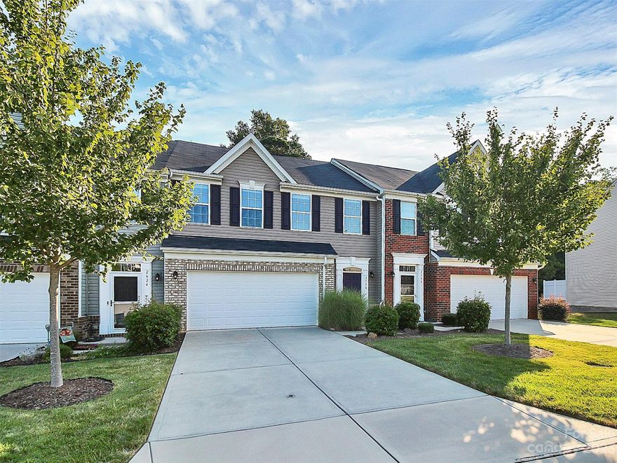 Gorgeous upgraded townhome in lake front community. Community pool and clubhouse right on the lake! Fenced boat and RV storage available. Kayak access near pool area. Kitchen cabinets extended into dining area to add lots of extra storage. Two modern wall fireplaces built-in to living room and primary bedroom for added coziness over the winter months. Large kitchen with big island, granite and upgraded gas stove. Sliding barn door has been added to the half bath for convenience. Hard surface floors throughout 1st floor. Primary bedroom with fireplace, walk-in closet, tray ceiling and large upgraded luxury bath with tiles floors, soaking tub, big shower and separate water closet. Upgraded lighting throughout, some with dimmer switches. Large deck with fenced backyard looks into trees – so peaceful! Tankless water heater. Huge walk-up attic with tons of storage. HVAC serviced bi-annually. Water & sewer is paid by the HOA.