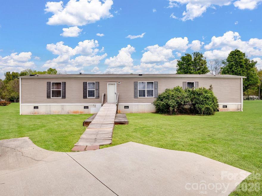 Situated on a spacious 1.27-acre corner lot, this home offers an open, level setting with plenty of room for entertaining. A wired, oversized detached garage provides the perfect space for a workshop or extra storage. Inside, the open floor plan connects the living room, dining area, and kitchen, creating a welcoming and functional layout. The kitchen features ample cabinetry and a large island with a breakfast bar, while the split-bedroom floor plan offers added privacy and comfort. Plenty of parking in the driveway. Enjoy the Quiet Country life!