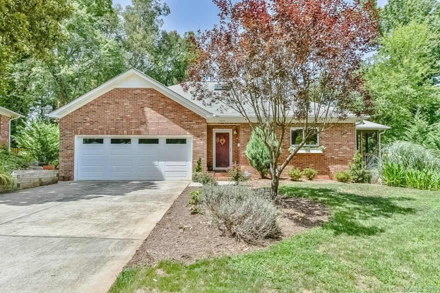 Traditional Madison Park ranch/basement on the outside, fabulous European style inside!  This 2002 energy efficient beauty lives easily; bright sunny kitchen w/granite flows to dining, large living room w/wall of windows overlooking trees, swedish wood stove, maple floors! Master suite on main w/walk-in closets, luxury bath w/dual vanities, separate tub & shower. 2 spacious BRs down, rec room, great storage, utility room w/w/d hookups.  Big 2-car garage w/sink. Screened porch, deck.