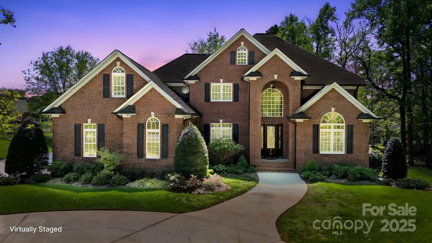 As you enter this grand full brick residence on 1.4 acres prepare to be impressed by the airy foyer & grand dual access staircase. The foyer is flanked by a formal dining room/flex space and a French doored office w/built-in desk & shelving. Adjacent great room is highlighted by the custom gas log fireplace & built in book shelves, crown molding, plantation shutters and 10 ft ceilings. The room extends to the eat in kitchen w/custom cabinetry, island work space, wall oven & pantry then flows seamlessly to the EZ Breeze 3 season sunroom extending in & outdoor entertaining options all while enjoying the park like backyard setting. Main floor primary bedroom retreat was recently updated to include a spa bath featuring 2 vanities & walk in closets, beautifully accented tiled shower & soaking tub. Custom main floor laundry adjacent to the oversized 2 car garage. Upstairs has an additional 4 bedrooms and 2 updated baths plus game room with wet bar. Excellent storage throughout the home.