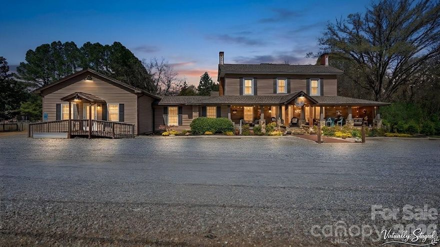 Built in 1870 and reimagined for the way people live today, 1307 Oakridge Farm Hwy is one of those rare properties that makes you stop mid-sentence when you walk through the door. Vaulted cedar ceilings. Stone fireplaces. A Viking gourmet kitchen built for feeding people you love — and fresh eggs from your own chickens to cook in it every morning.

Operating as Silly Chickens Lodge — Mooresville's only true 5-star Airbnb bed & breakfast — this estate generates $2,550/month in gross income: two nightly guest suites at $150/night each, plus a private guest cottage rented at $1,050/month with all utilities included ($12,600/yr). Airbnb Superhost status, platform, website & social media transfer with the sale.

No HOA. No rules. RV hookup available. 5-car garage + detached garage/shop. Parking for 12-15 vehicles. Work from home with high-speed fiber optic internet. Host weddings, retreats & race-weekend parties on a 1,500 SF composite deck with hot tub, pergola & fire pit. Minutes from GoPro Motorplex, the Auto Racing Hall of Fame & Lake Norman. 13 acres of land behind the property ensure your privacy.

Live here. Work here. Host here. Earn here. This is the one.